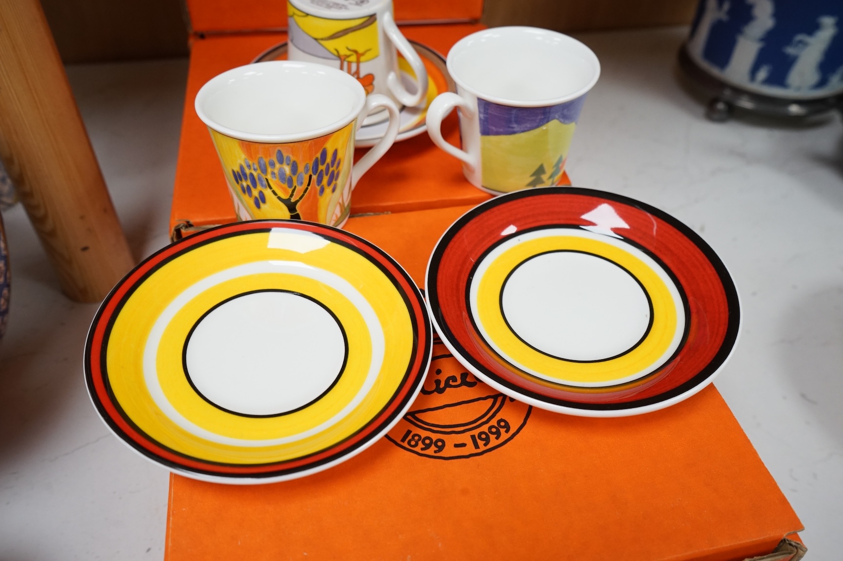 Four boxed limited edition Clarice Cliff cups and saucers to include Blue Lucerne and Windbells, saucers 11cm in diameter